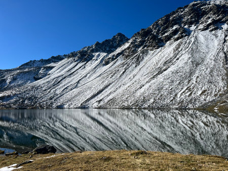 High alpine lake Lai da la Scotta (Schottensee or Schotten Lake) on the Swiss mountain road pass Fluela (FlÃ¼elapass), Davos - Canton of Grisons, Switzerland (Kanton GraubÃ¼nden)の写真素材
