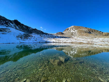 Nameless high alpine lakes in the Abula Alps mountain massif and above the Swiss road pass Fluela (FlÃ¼elapass), Zernez - Canton of Grisons, Switzerland (Kanton GraubÃ¼nden, Schweiz)の写真素材