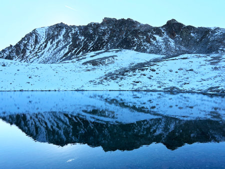 Nameless high alpine lakes in the Abula Alps mountain massif and above the Swiss road pass Fluela (FlÃ¼elapass), Zernez - Canton of Grisons, Switzerland (Kanton GraubÃ¼nden, Schweiz)の写真素材
