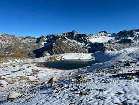 Nameless high alpine lakes in the Abula Alps mountain massif and above the Swiss road pass Fluela (FlÃ¼elapass), Zernez - Canton of Grisons, Switzerland (Kanton GraubÃ¼nden, Schweiz)の写真素材