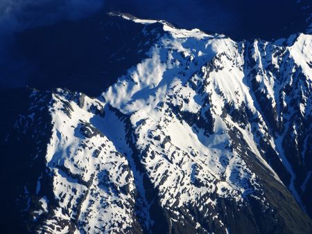 mountain with snow view from the airplaneの写真素材