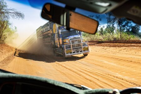 driving in the Australian outback on a dusty road