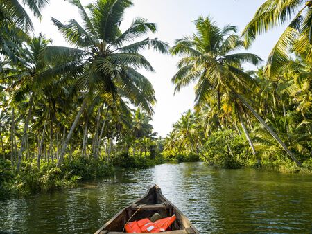 river cruise in the Kerala backwaters with traditional wooden fisherman boat