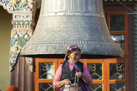 Kathamdu, nepal-November 02,2017:portrait of an old Tibetan women in traditional  clothes with a...