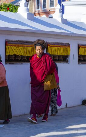 Kathmandu, Nepal-November 02,2017:religious Tibetan monk and women is walking around the Stupa of Bodnath in Kathmanduのeditorial素材