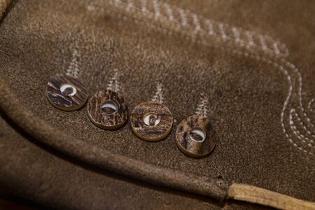 close up of an alpine leather trouser with stag horn buttonの写真素材