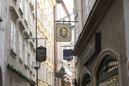 Salzburg, Austria-September 24,2017: street front with various store names  down town Salzburg cityのeditorial素材