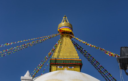 golden roof of the Stupa of Bodnath in Kathmandu with Tibetan flagsのeditorial素材
