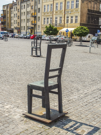 Krakow, Poland-June 11,2015:
square in Podgorze in Kracow with a ghetto memorial with empty ,iron chairsのeditorial素材