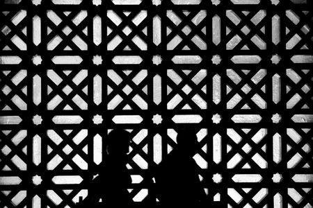 Black and white silhouette of people visiting Cordoba Mosque, Spainのeditorial素材
