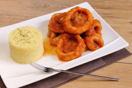 Plate of couscous with calamari in tomato sauceの写真素材