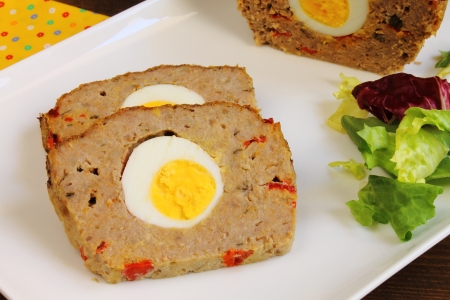Meatloaf with boiled egg and red pepperの写真素材