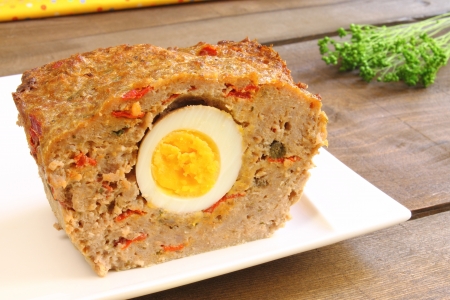 Meatloaf with boiled egg and red pepperの写真素材