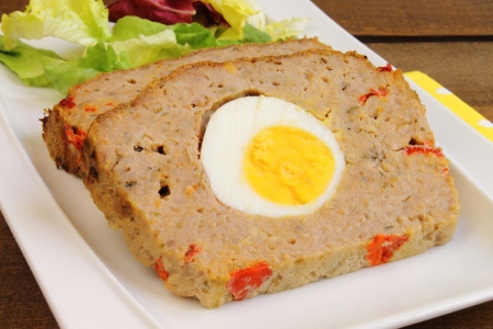 Meatloaf with boiled egg and red pepperの写真素材