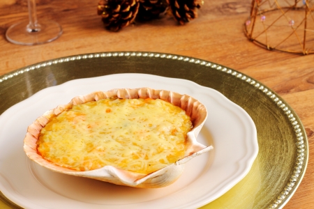 Stuffed scallop shells on a Christmas tableの写真素材