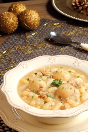 Cuttlefish and white beans stew on a Christmas tableの写真素材
