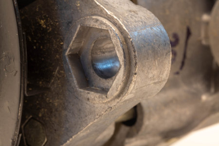 Close-up of a nut and bolt on a wheel of a car