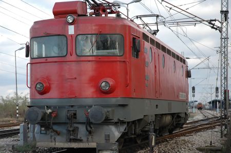 Red locomotive coming towardsの写真素材