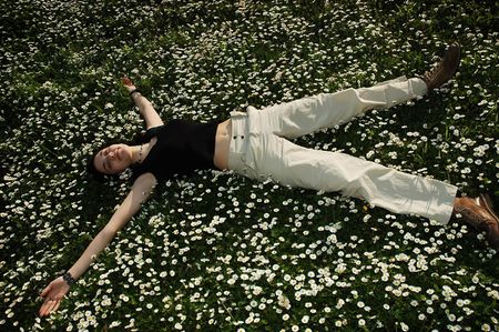 Girl sleeping in the flowersの写真素材