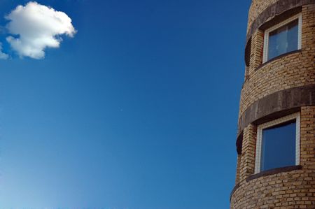 Small cloud looks after careful building of residual quartersの写真素材