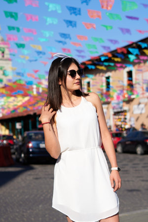 Woman with white dress, sunglasses, with white test in Real del Monte, Hidalgo Mexicoの写真素材