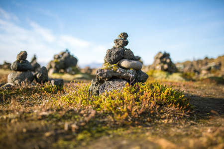 Laufscalavarda, a lava ridge, surrounded by stone cairns - South Icelandの写真素材