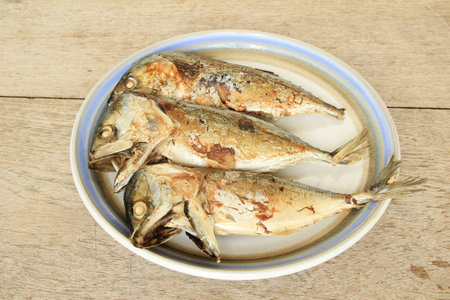 Fried mackerel on the dishの写真素材