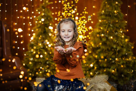 A happy little girl makes a wishの写真素材