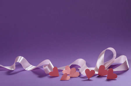 Herts with sequins on a violet background.の写真素材