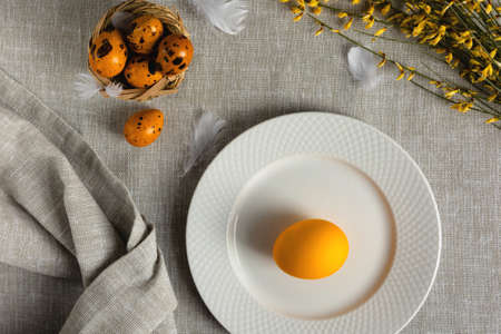 Easter quail eggs on a gray background