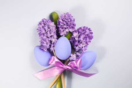Easter card on a gray background with flowers and Easter eggs.の写真素材