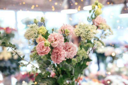 A beautiful and delicate bouquet with pink carnations for a postcard and as a gift.