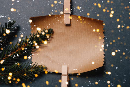 Christmas layout ecological craft packaging on a gray background with snow top view.
