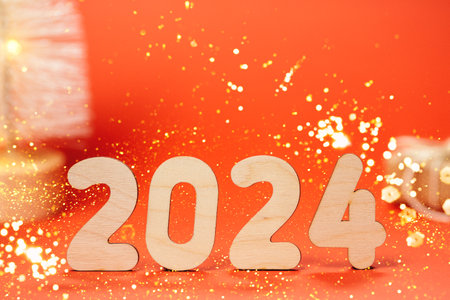 The number 2024 on a shiny red background top view