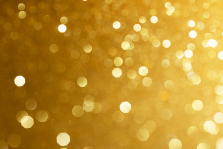 Golden glittering background for design and free space and place for text.