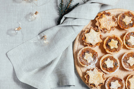 Christmas mince pies with fruit filling on a gray background. Fragrant pies for tea. English traditional pastry.の写真素材