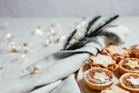 Christmas mince pies with fruit filling on a gray background. Fragrant pies for tea. English traditional pastry.の写真素材