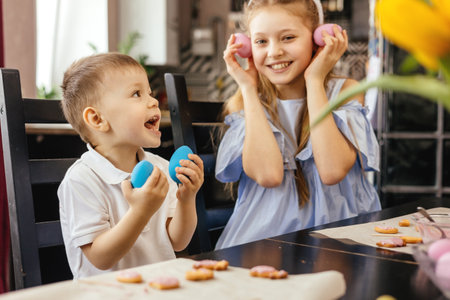 Little boy and girl are preparing for Easter, having fun and playing. Easter eggs.の写真素材
