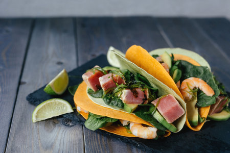 Mexican appetizer poke tacos with fish, mix of cultures, regional cuisine and national, asian, fusion.の写真素材