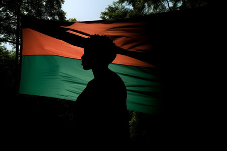 The silhouette of a woman is a symbol of freedom of the day celebrating the abolition of slavery in the USA. With Generative AI technology.の素材