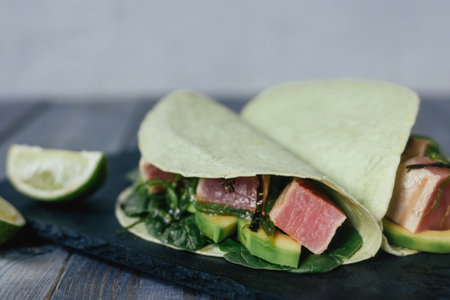 Mexican appetizer poke tacos with fish, mix of cultures, regional cuisine and national, asian, fusion.の写真素材