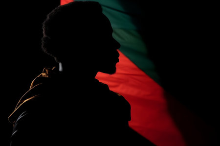 The silhouette of a man is a symbol of freedom of the day celebrating the abolition of slavery in the USA. With Generative AI technology.の素材