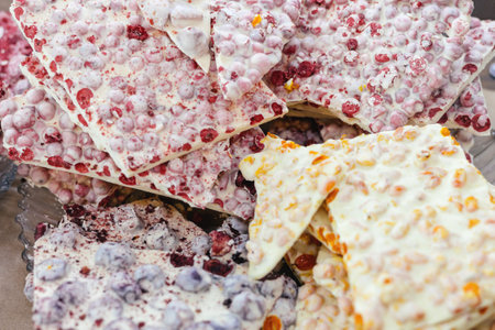 Handmade chocolate with additives on the counter. own production. sweets. market.の写真素材