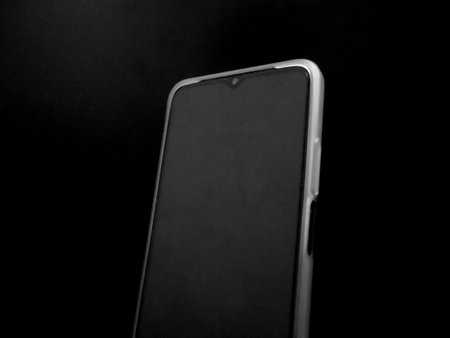Grayscaled Phone Surface with Front Camera, on Black Background