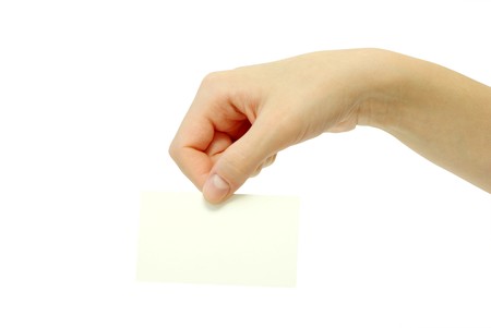 card blanks in a hand on white backgroundの写真素材