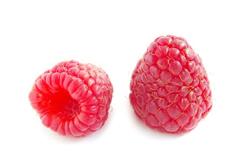fresh raspberry fruits  isolated on white backgroundの写真素材