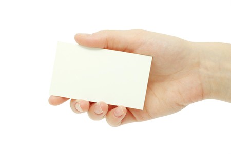 card blanks in a hand on white backgroundの写真素材