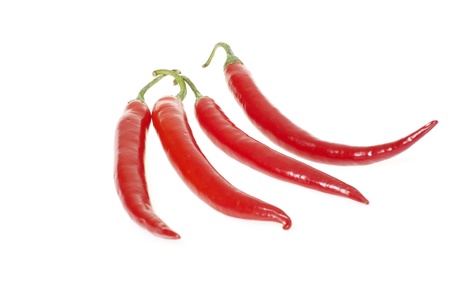 Red hot chili peppers on white background