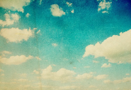 grunge image of blue sky with cloudsの写真素材