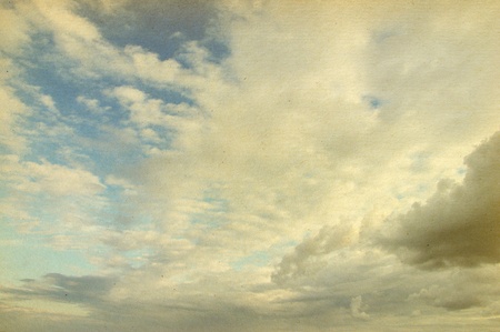 grunge image of blue sky with cloudsの写真素材